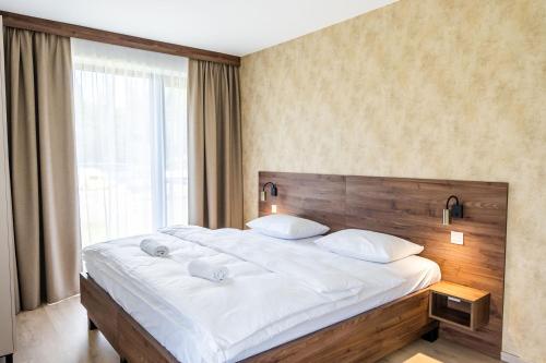 Postel nebo postele na pokoji v ubytování Apartmány Hájenka Oravice