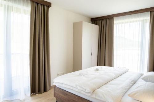 Postel nebo postele na pokoji v ubytování Apartmány Hájenka Oravice