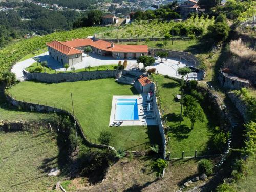 an aerial view of a house on a hill at Casa de Belmonte in Castelo de Paiva