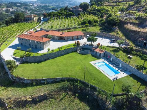 an aerial view of an estate with a swimming pool at Casa de Belmonte in Castelo de Paiva
