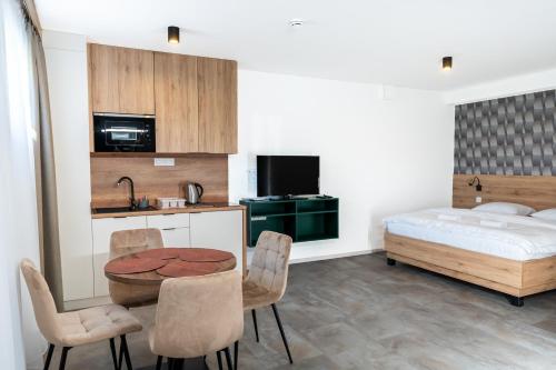 Postel nebo postele na pokoji v ubytování Apartmány Hájenka Oravice