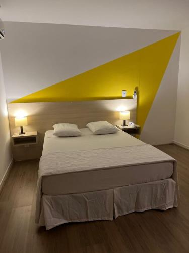Ένα ή περισσότερα κρεβάτια σε δωμάτιο στο Mova Express Hotel - CAMPINAS