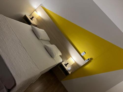 Una cama o camas en una habitación de Mova Express Hotel - CAMPINAS