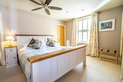 a bedroom with a large bed and a window at The Brierley in York