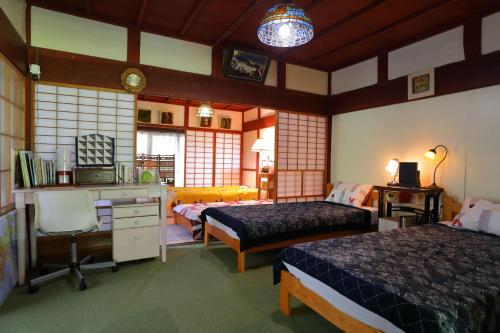 Postel nebo postele na pokoji v ubytování 棚田ハウス