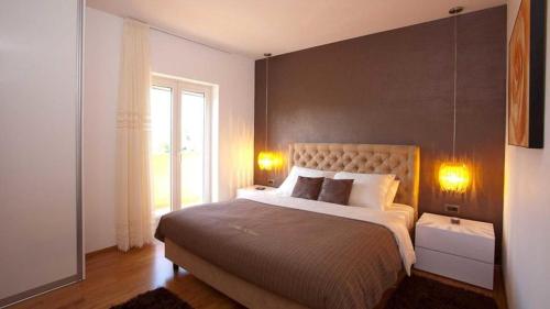 Ένα ή περισσότερα κρεβάτια σε δωμάτιο στο Villa Diora