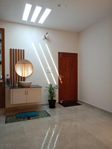 an empty room with a door and a light at Casa Branca Retreat in Varkala