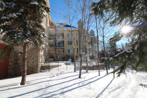 a snow covered street in front of a building at Tremblant Prestige - BONDURANT 95-10 in Mont-Tremblant