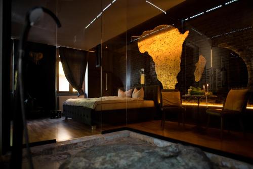 En eller flere senge i et værelse på World Studio Africa