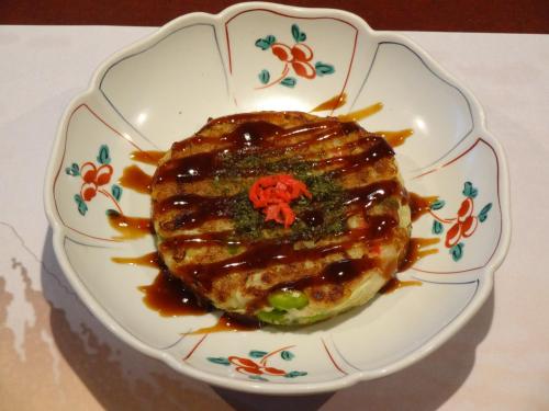 a plate with a piece of food with sauce on it at IZUNA INN & SPA - the veggie delights in Ito