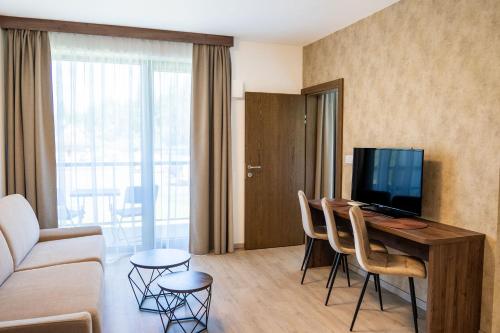 TV a/nebo společenská místnost v ubytování Apartmány Hájenka Oravice