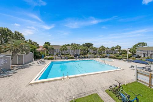 an image of a swimming pool at a resort at Southbay by the Gulf 11 a 4 Bedroom Townhome with Beach Access and 300ft of Private Beach in Destin