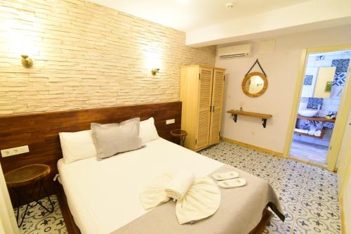 Ένα ή περισσότερα κρεβάτια σε δωμάτιο στο Micel Otel Alacati
