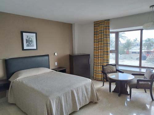 Postel nebo postele na pokoji v ubytování Hotel Mar y Tierra