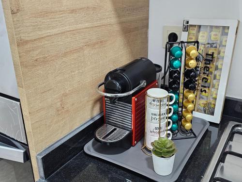 a coffee maker sitting on a shelf next to a door at 3 Bedroom Luxury Apartment with Premium Amenities for Larger Families in Casablanca