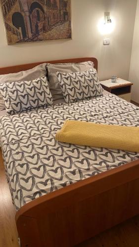 an unmade bed in a bedroom with at Vila Bianca in Umag