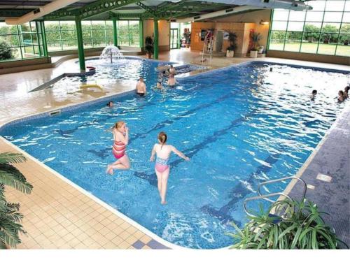 a group of people in a swimming pool at Garden View Retreat in Ulrome