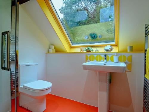 a bathroom with a sink and a toilet at 3 Bed in Capel-y-Ffin 93362 