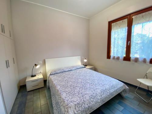 Giường trong phòng chung tại Appartamento Giulia