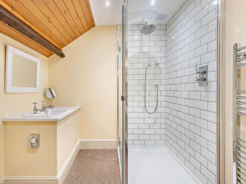 a bathroom with a shower and a sink at 3 Bed in Kirkby Stephen 93379 in Orton