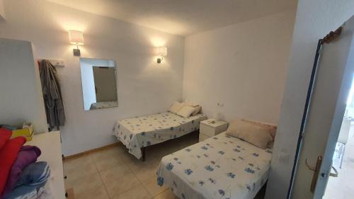 Postel nebo postele na pokoji v ubytování Casa Leon