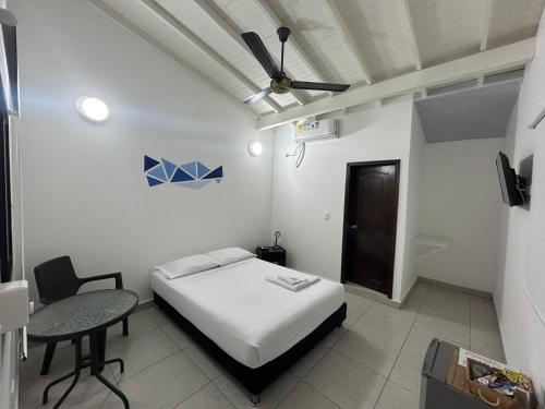 מיטה או מיטות בחדר ב-Hotel Puerto Azul
