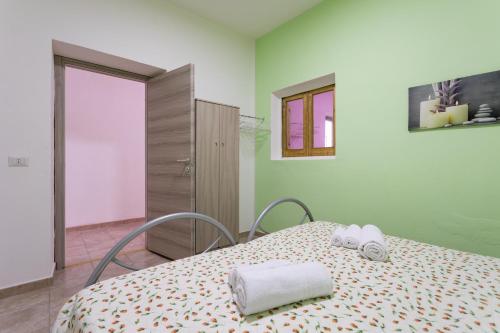 Ένα ή περισσότερα κρεβάτια σε δωμάτιο στο Casa Nonno