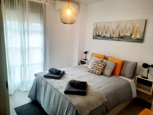 Postel nebo postele na pokoji v ubytování at jardines del mar