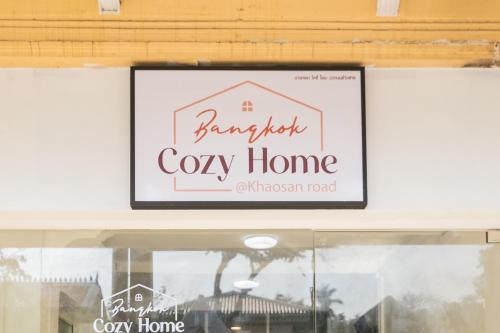 a sign in a window of a cozy home at Bangkok Cozy Home @Khaosan Road in Bangkok