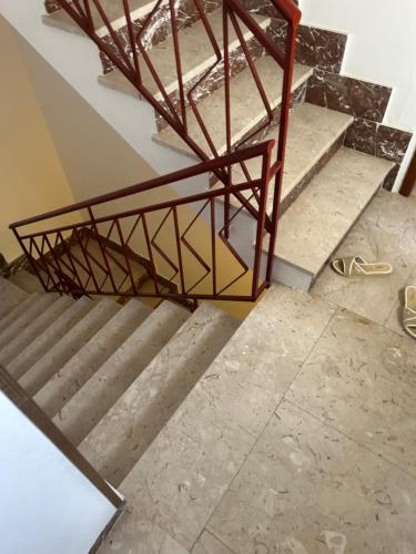 a set of stairs with a metal railing on them at Gli Ulivi in Marinella di Selinunte