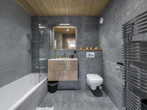 a bathroom with a toilet and a sink and a shower at Appartement Courchevel 1650, 4 pièces, 6 personnes - FR-1-563-36 in Courchevel