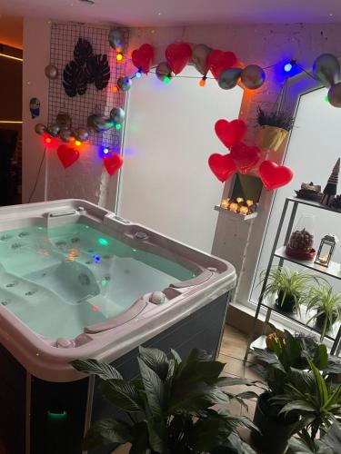 a jacuzzi tub in a living room with lights at wySPAne Katowice in Katowice