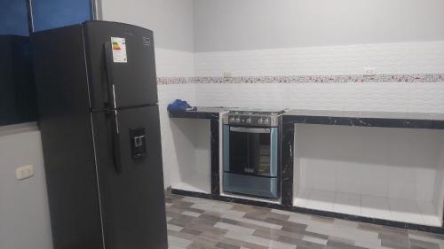 Kuchyň nebo kuchyňský kout v ubytování Casa Alojamiento Picuro Lodgind