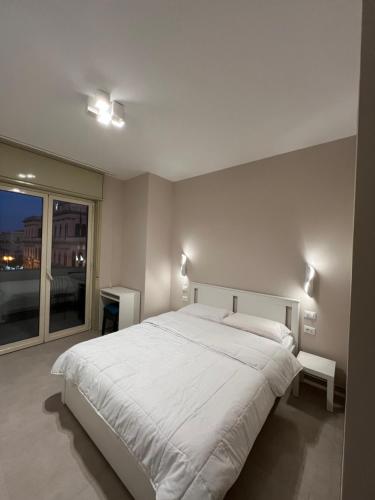 Postel nebo postele na pokoji v ubytování CESARE ROOMS