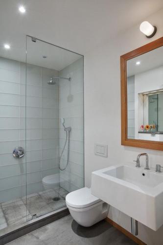 a bathroom with a shower and a toilet and a sink at Apart-hotel Magestic EVN Airport in Pʼarakʼar