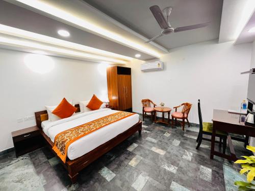Ένα ή περισσότερα κρεβάτια σε δωμάτιο στο Hotel Green Galaxy - Green Park South Delhi