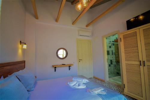 Ένα ή περισσότερα κρεβάτια σε δωμάτιο στο Micel Otel Alacati