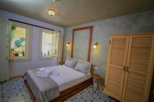 Ένα ή περισσότερα κρεβάτια σε δωμάτιο στο Micel Otel Alacati