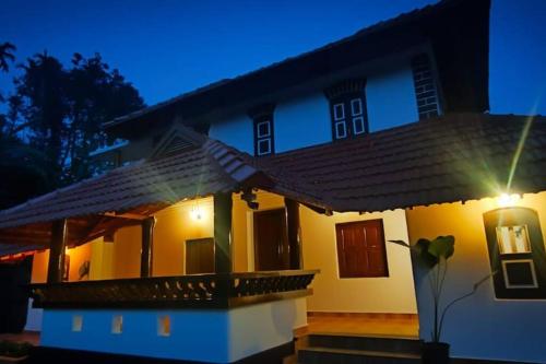 a house with a light on top of it at Aadhya Homestay 4BHK in Wayanad