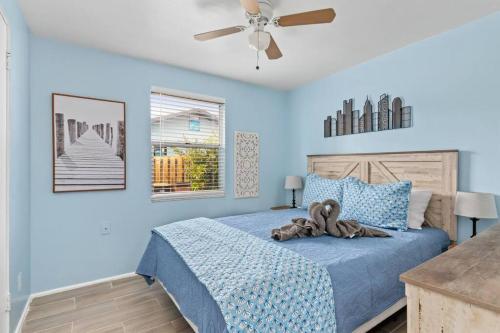 a bedroom with a bed with a teddy bear on it at Downtown Punta Gorda 3 bd Bungalow in Punta Gorda