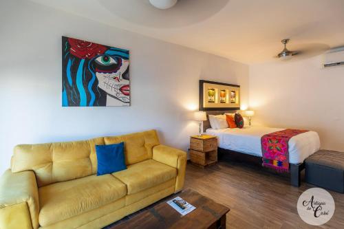 a living room with a couch and a bed at Antigua de Cabo in Cabo San Lucas