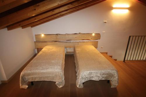 Una cama o camas en una habitación de Vigne di Scanzo