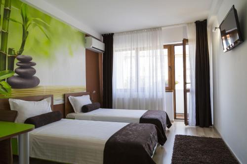 Postel nebo postele na pokoji v ubytování Hotel GabriSa