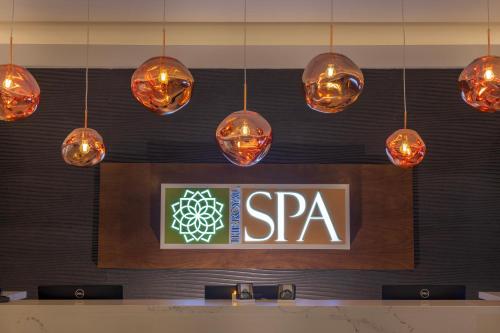 a restaurant with lights hanging from the wall at Royalton Splash Riviera Cancun, An Autograph Collection All-Inclusive Resort in Cancún