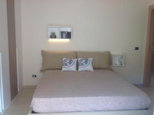 Łóżko lub łóżka w pokoju w obiekcie Casa Vacanze Letojanni