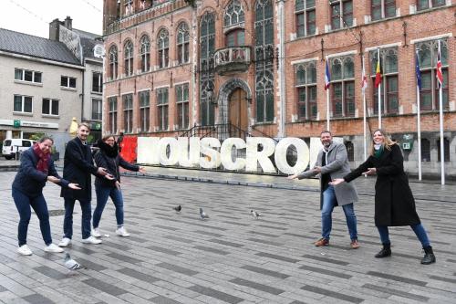 a group of people standing in front of a sign at Hotel & Aparthotel Alize Mouscron in Mouscron