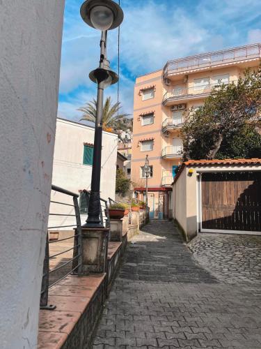 a street light next to a building on a street at Putechella's Apartments in Maiori
