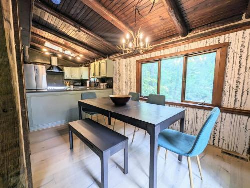 a dining room table and chairs in a kitchen at Rustic Escape in Greenwood Lake in West Milford