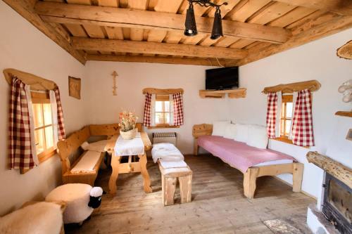 a living room with a couch and a table at Penzión Zbojnícky Halaš in Tisovec