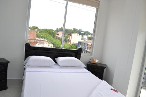 Krevet ili kreveti u jedinici u okviru objekta hotel brasil